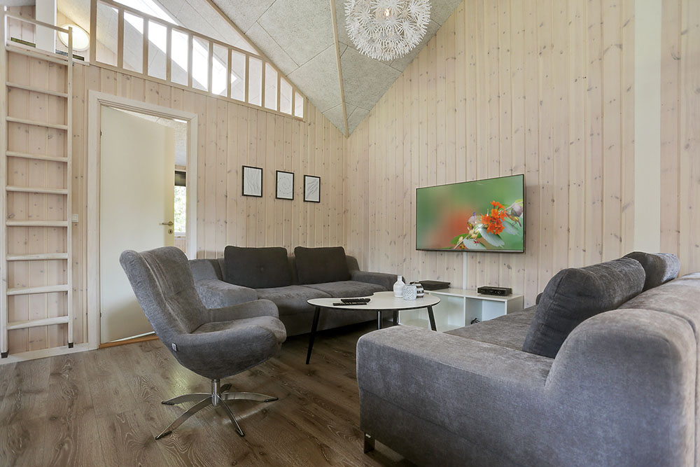 Tävla i sommarhusets aktivitetsrum när ni besöker lyxhus nr 369 i Nordsjälland.