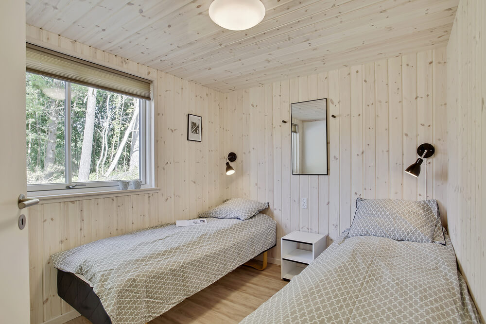 Ett av de 9 utmärkta sovrummen i lyxstuga nr 406 i Nordsjälland.