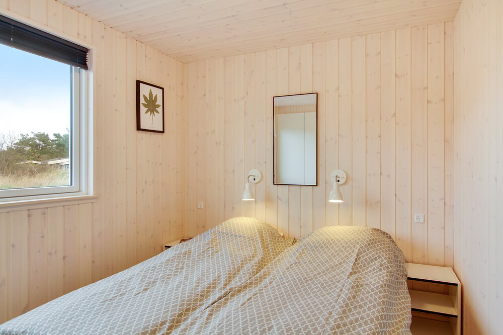 Ett av de 7 utmärkta sovrummen i lyxstuga nr 407 i Vestjylland.
