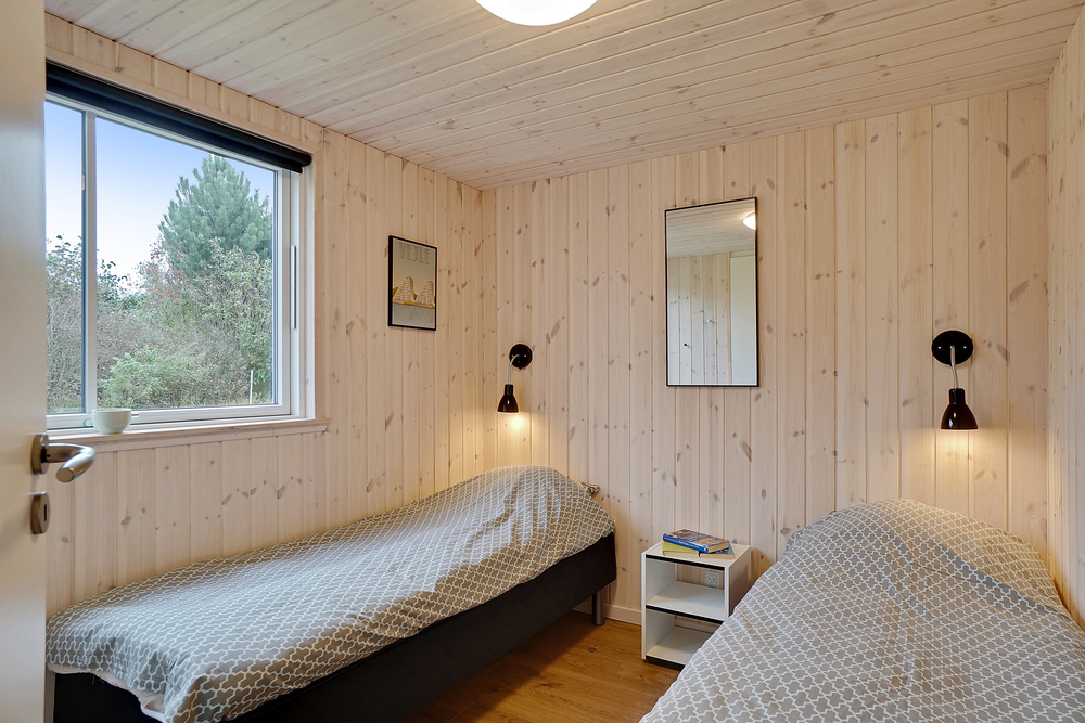 Ett av de 7 utmärkta sovrummen i lyxstuga nr 472 i Østjylland.