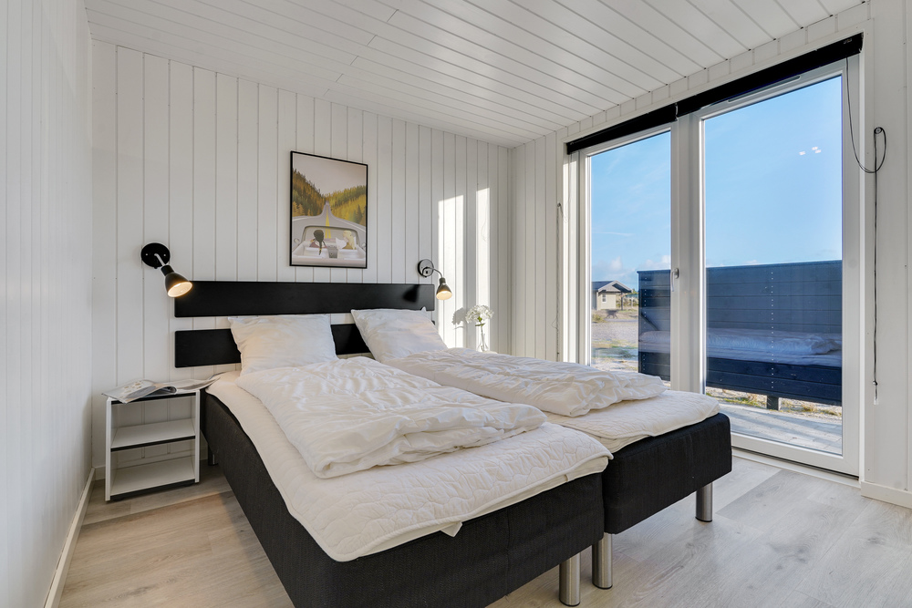 Ett av de 7 utmärkta sovrummen i lyxstuga nr 486 i Vestjylland.