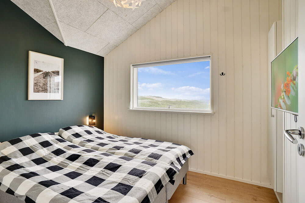 Ett av de 5 utmärkta sovrummen i lyxstuga nr 514 i Nordjylland.