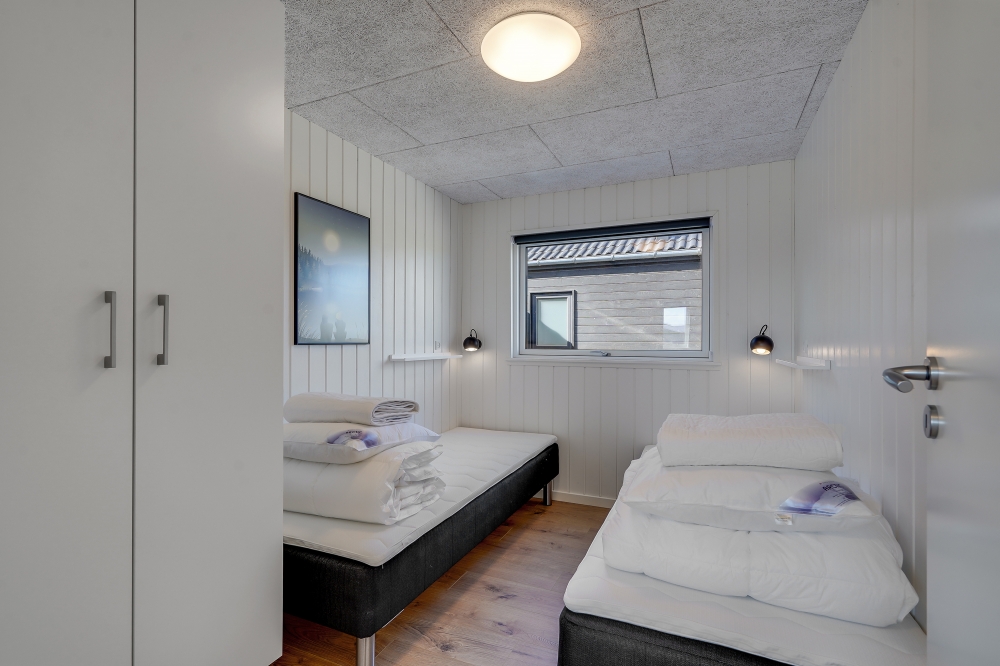 Ett av de 7 utmärkta sovrummen i lyxstuga nr 558 i Vestjylland.