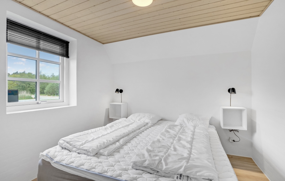 Ett av de 7 utmärkta sovrummen i lyxstuga nr 576 i Vestjylland.