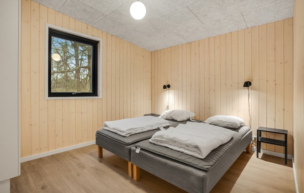 Ett av de 7 utmärkta sovrummen i lyxstuga nr 581 i Østjylland.