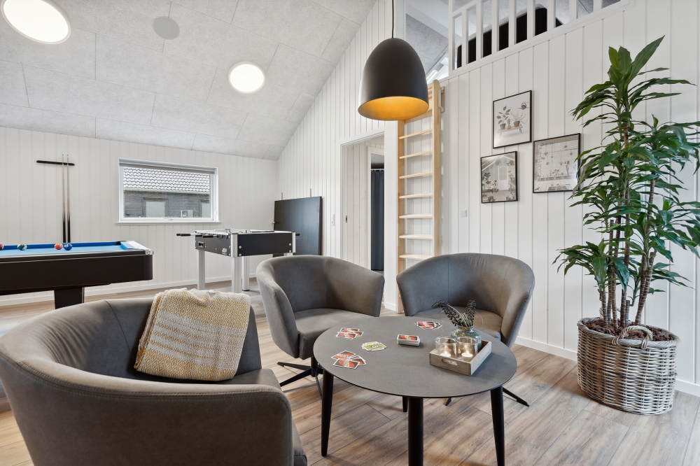 Tävla i sommarhusets aktivitetsrum när ni besöker lyxhus nr 599 i Sydjylland.