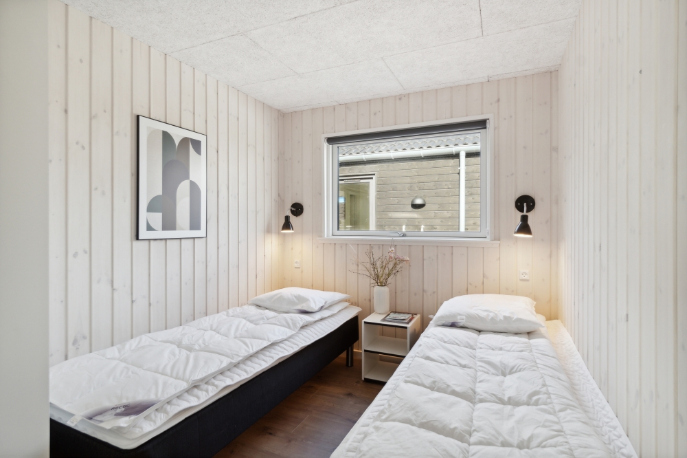 Ett av de 5 utmärkta sovrummen i lyxstuga nr 584 i Nordsjälland.