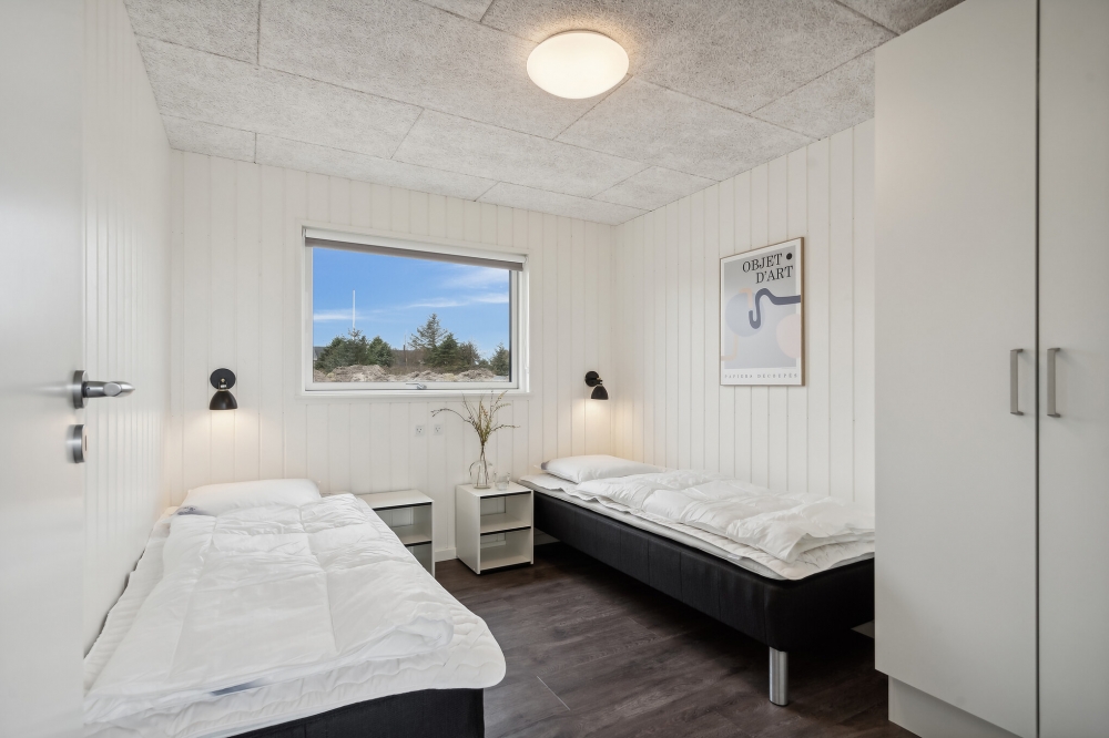 Ett av de 7 utmärkta sovrummen i lyxstuga nr 610 i Vestjylland.