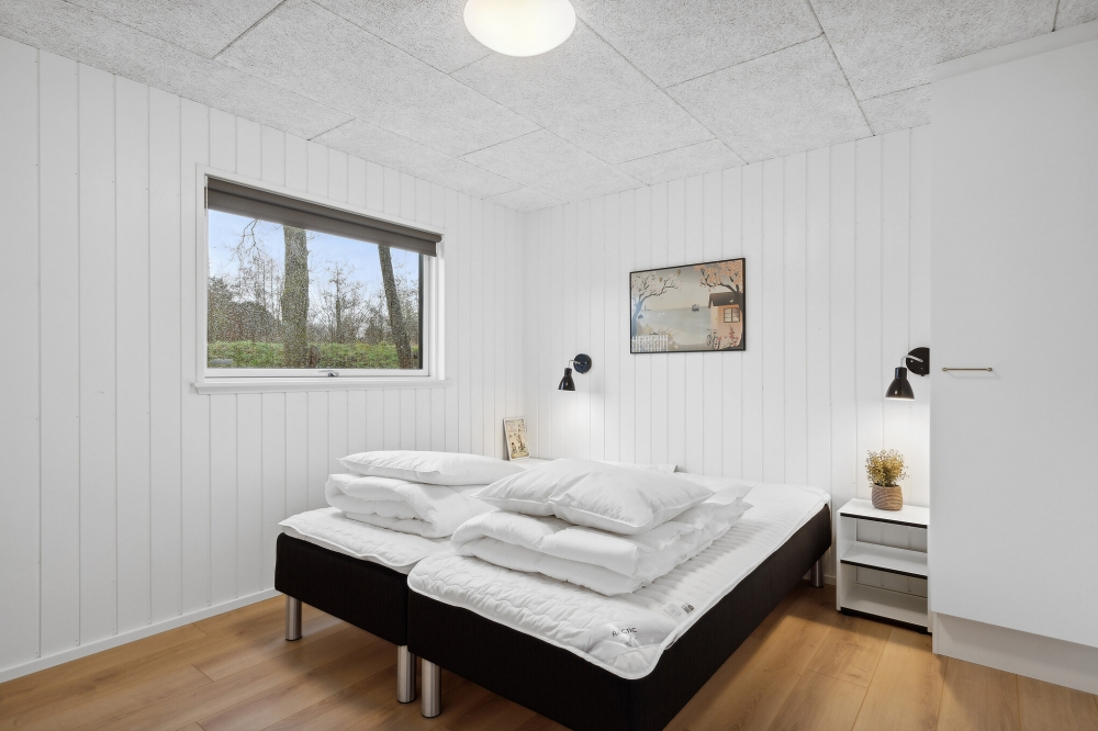 Ett av de 8 utmärkta sovrummen i lyxstuga nr 657 i Sydjylland.