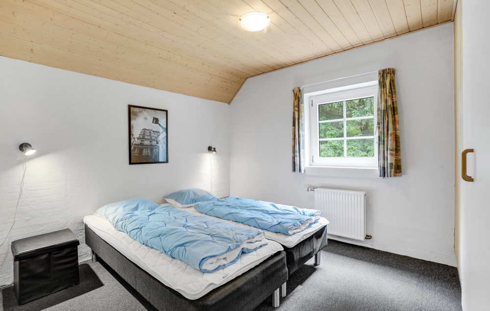 Ett av de 9 utmärkta sovrummen i lyxstuga nr 135 i Vestjylland.
