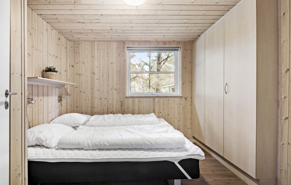 Ett av de 9 utmärkta sovrummen i lyxstuga nr 197 i Vestjylland.