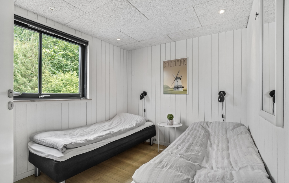 Ett av de 7 utmärkta sovrummen i lyxstuga nr 276 i Nordsjälland.
